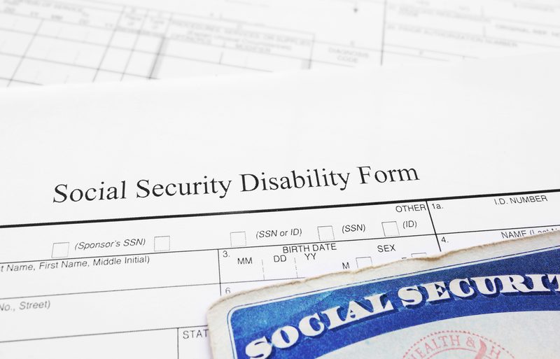 Social Security Disability form and Social Security card — understanding SSDI and SSI benefits